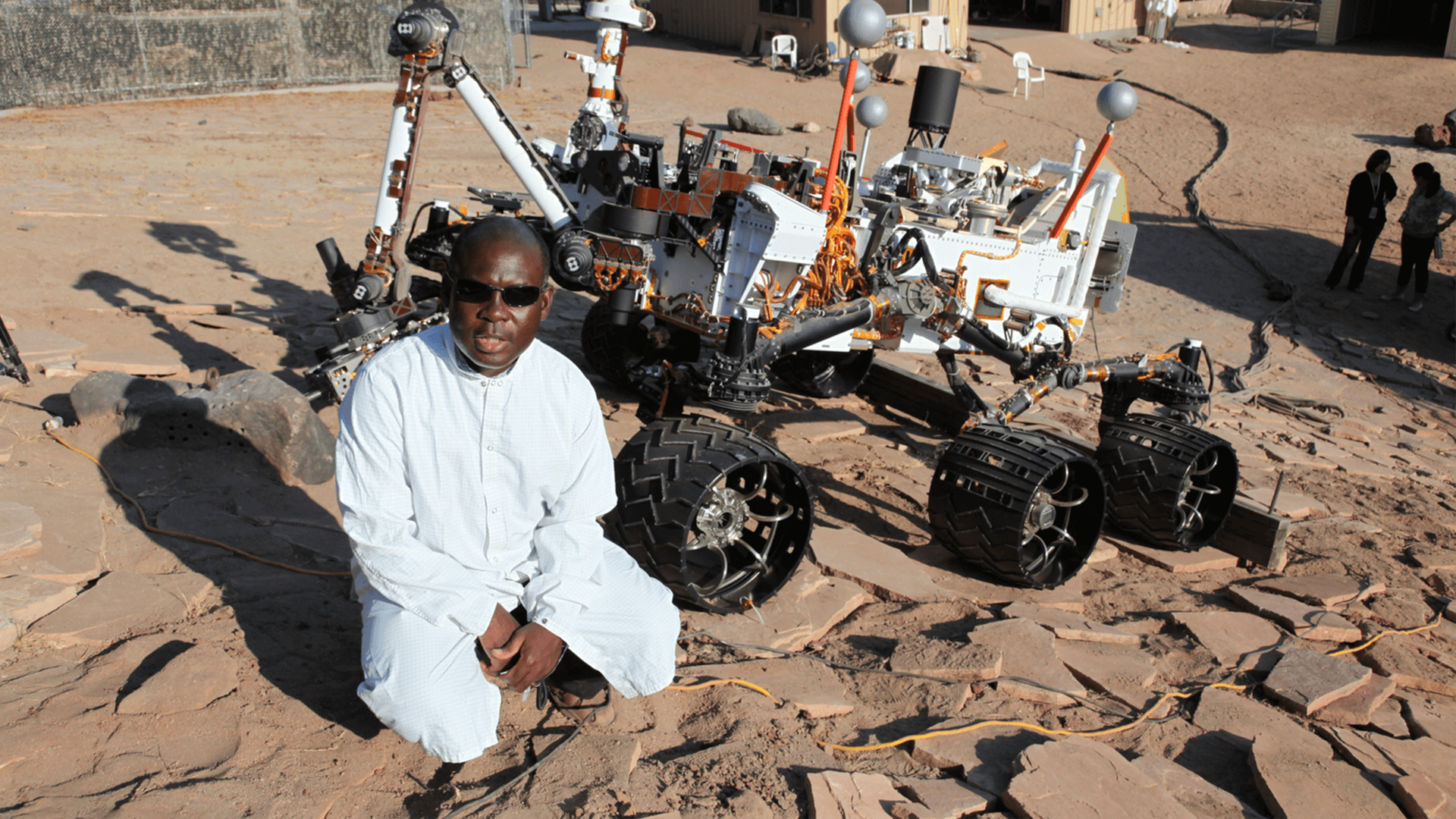 NASA engineer Ashitey Trebi-Ollennu, one of the robotic engineers in the Aspire programme, is shown at work with a prototype mars rover.