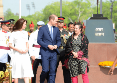 The Duke and Duchess of Cambridge speaking with guests at an India Remembers event at India Gate in New Delhi, India.